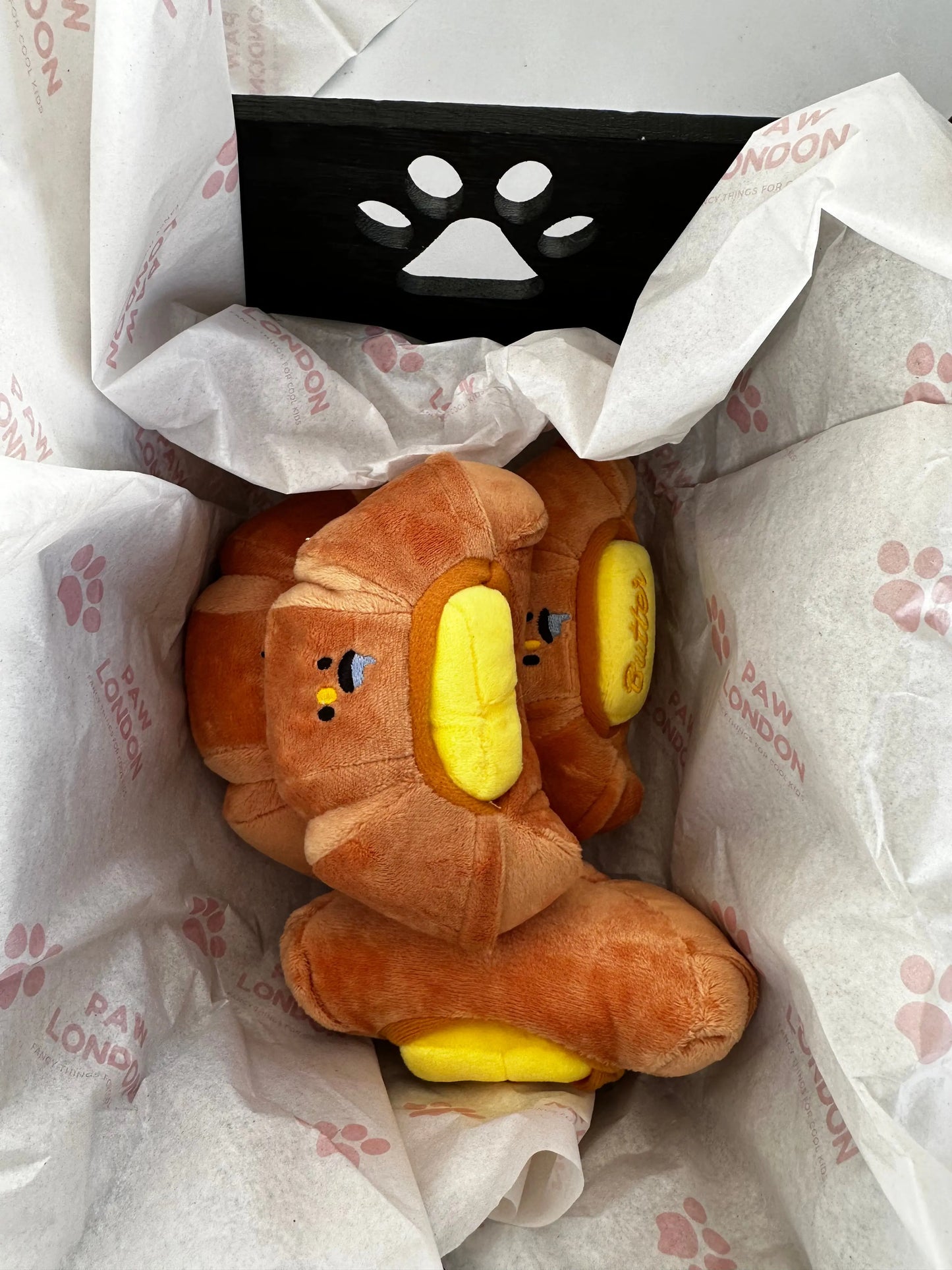 a stuffed animal sitting inside of a bag