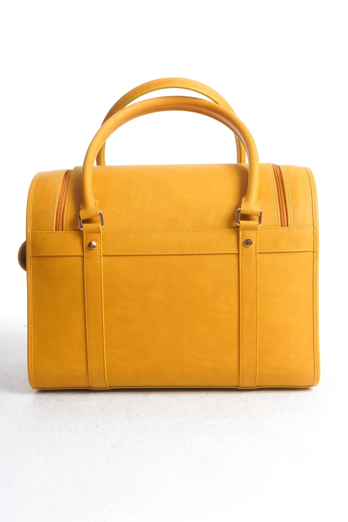 Back view of the Kelly Airline Approved Pet Travel Carrier Bag in Mustard by PAW LONDON, featuring the clean lines and luxurious leather structure, ideal for airline-approved pet transportation.