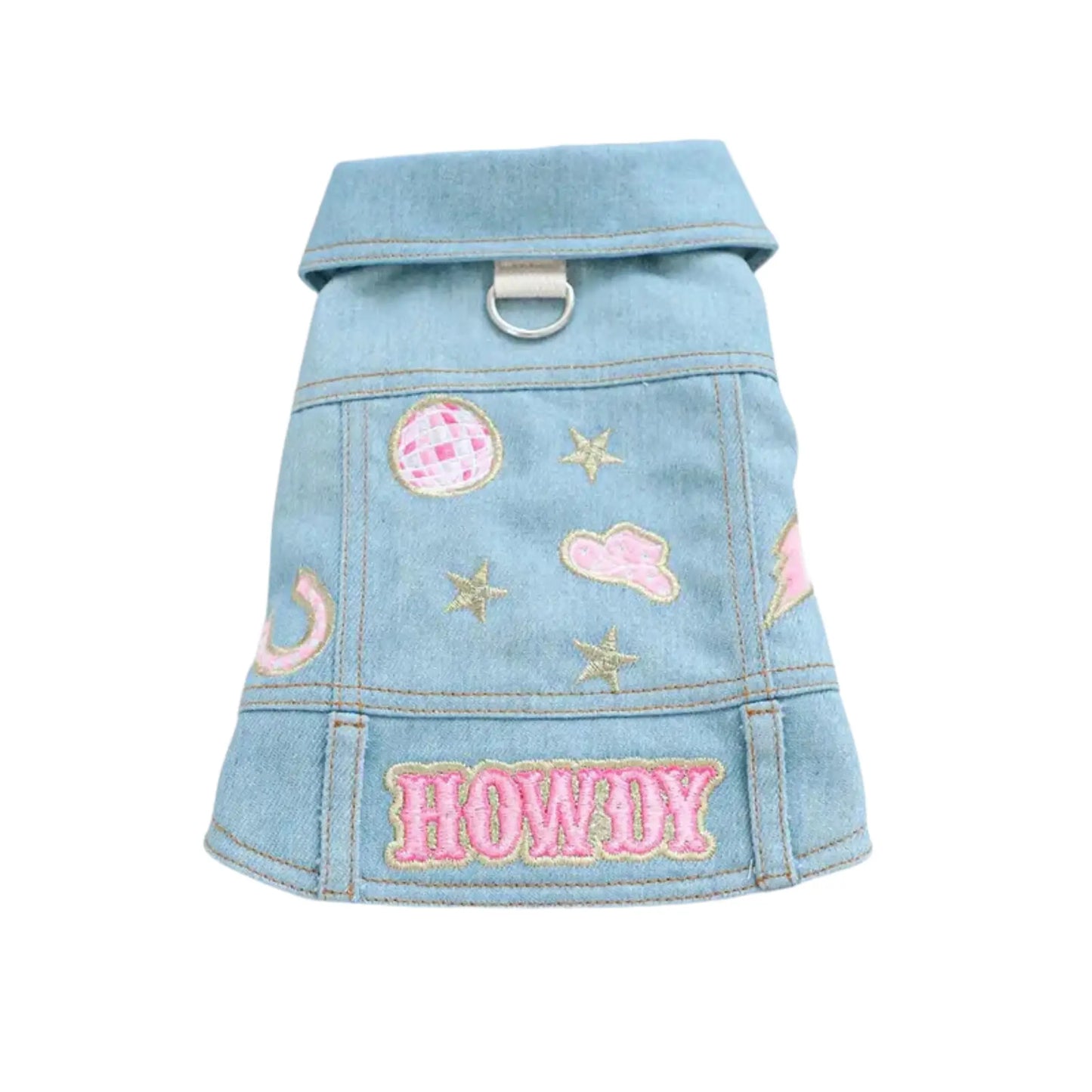 a small dog denim jacket with patches and stars on it