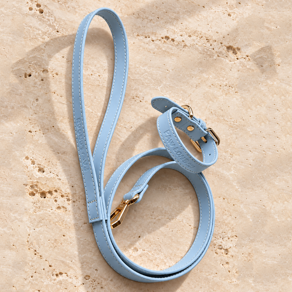 Basic Light dog collar and leash set in Baby Blue Matte on travertine