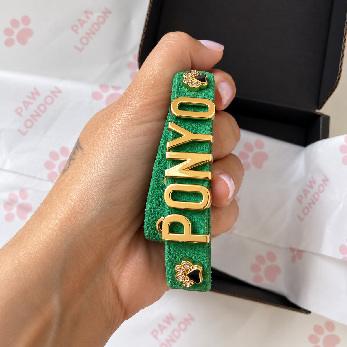 Green suede personalised dog collar with gold letters and paw charms