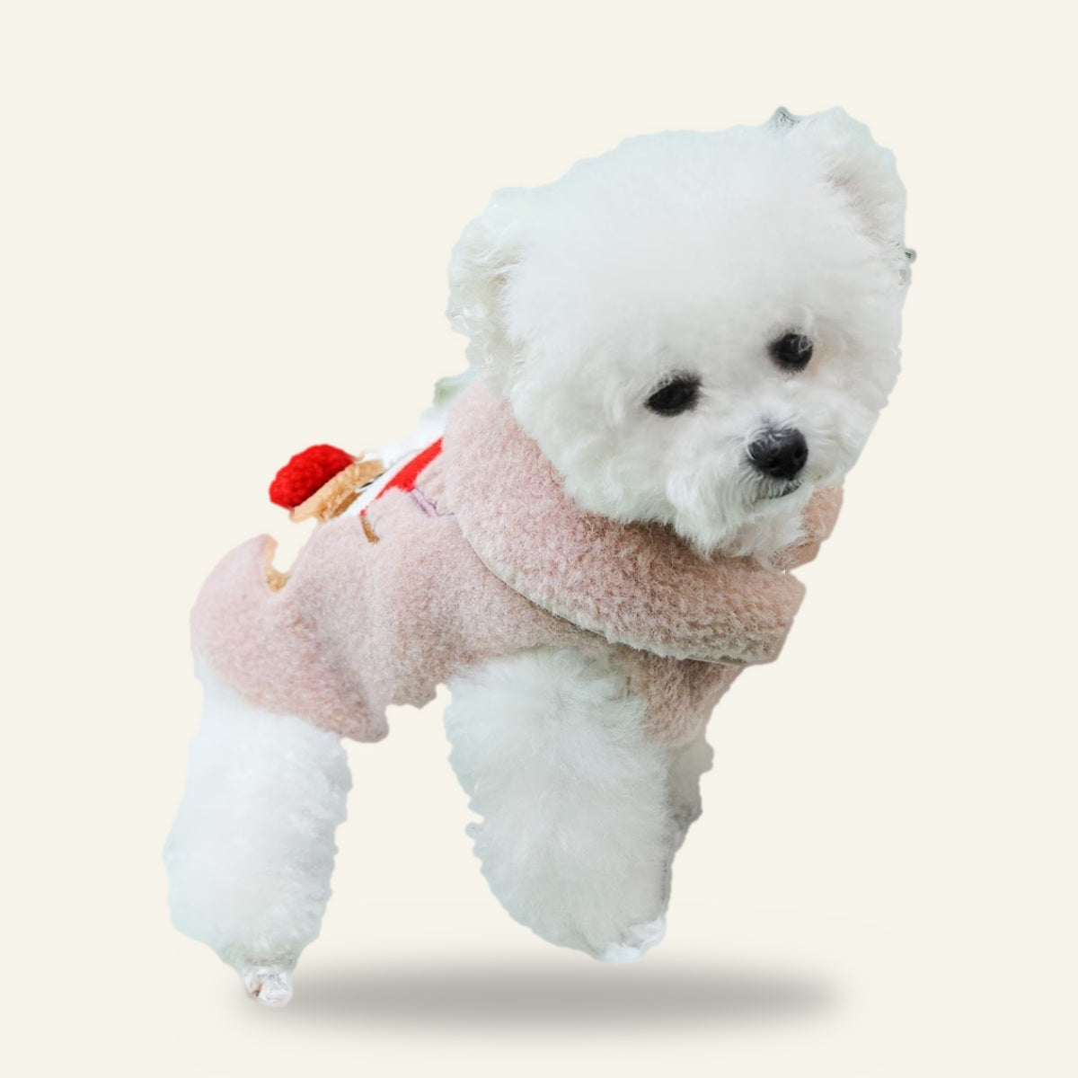 Dog wearing the pink reindeer vest, side view