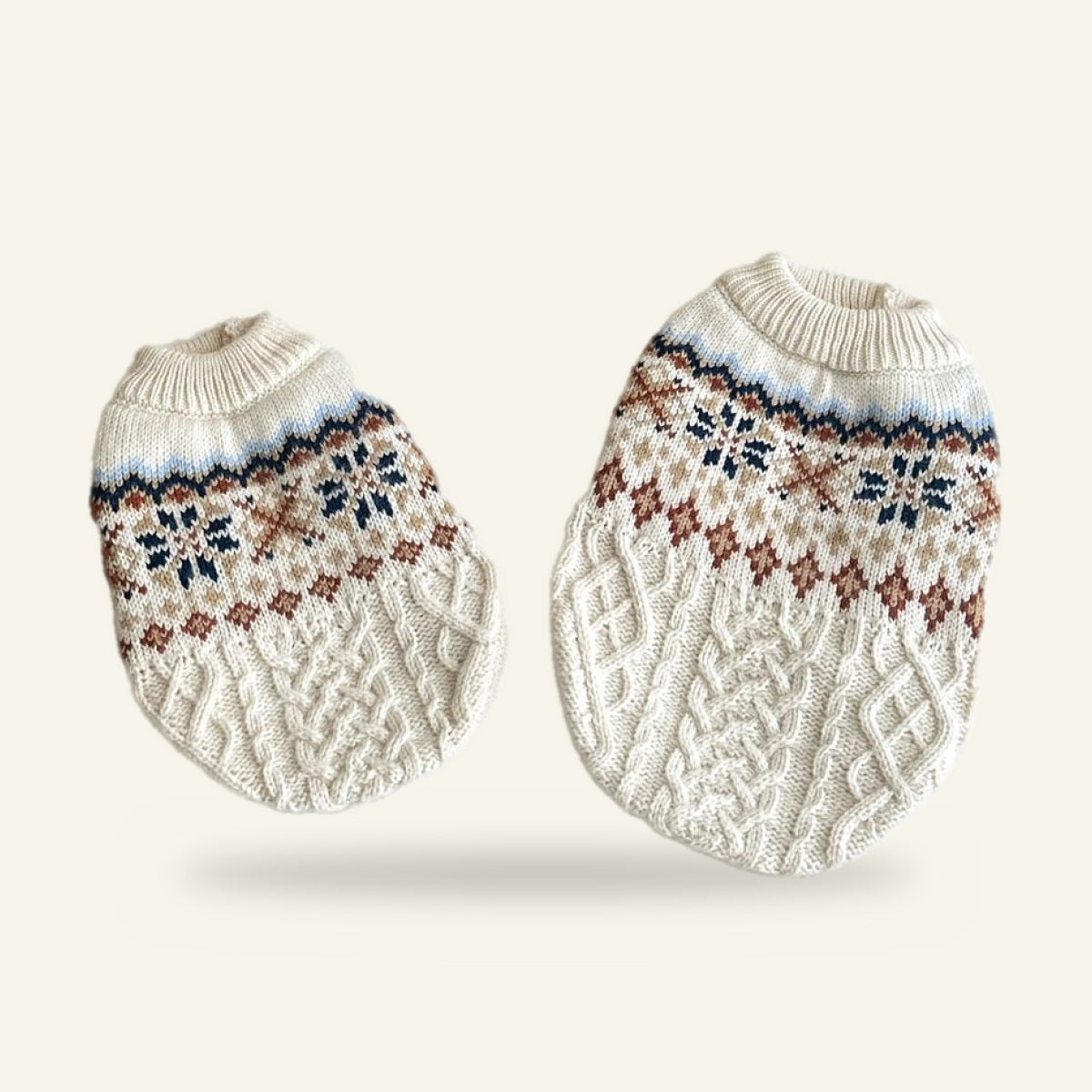 Two snowflake cable knit jumpers